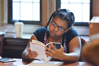 CTWStudent looking at book